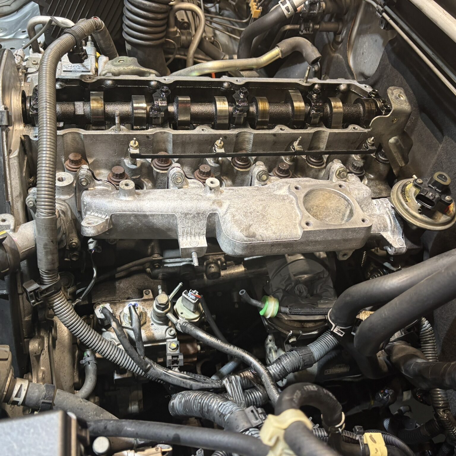 Manifold cover off on Toyota Hilux 1KD servicing continues